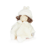 Stuffed toy with a white outfit and hat on a white background