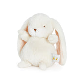 Cream plush bunny toy with a visible brand tag on a white background