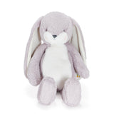 Plush toy rabbit with gray fur and white face on a white background