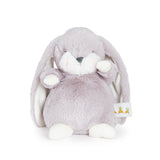 Plush toy rabbit with a tag on a white background