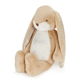 Plush toy rabbit with beige fur on a white background