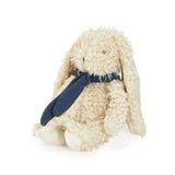 Beige plush bunny with a blue bandana on a white background