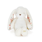 White plush bunny with colorful patterned ears on a white background