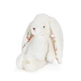 White plush bunny toy with in ear pattern on a white background