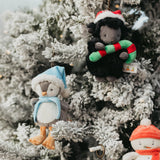 Decorative Christmas ornaments on a frosted tree