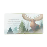 Illustrated book page with a moose in a forest