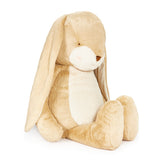 Beige plush bunny toy on a white background