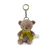 Plush bear keychain with a green scarf on a white background