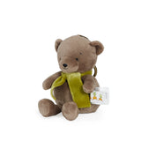 Plush teddy bear with a green scarf on a white background