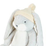 Plush bunny toy wearing a cream hat on a white background