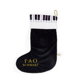 Black Christmas stocking with piano patterned cuff and FAO Schwarz logo on a white background