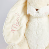 Cream plush bunny with 'Mom' embroidered on its ear against a light gray background