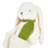 White plush bunny with a green scarf on a white background