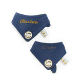 Two navy blue bandannas with embroidered names on a white background