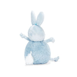 Back view of a small plush toy resembling a round blue bunny with a velour face, dangly arms and legs, and embroidered features.