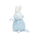 Side view of a small plush toy resembling a round blue bunny with a velour face, dangly arms and legs, and embroidered features.
