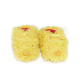 Front view of yellow chick themed baby booties with an elastic closure and red and cream striped lining.