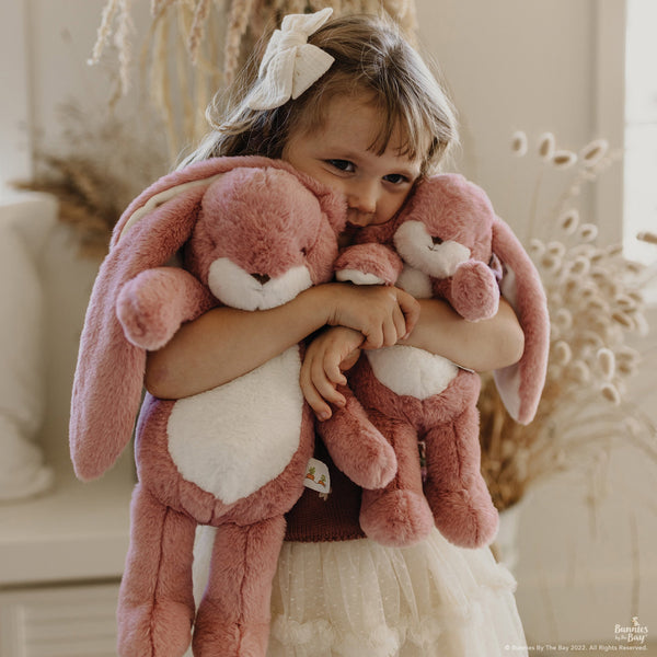 Little Girl holding Coral Blush Nibble Bunnies