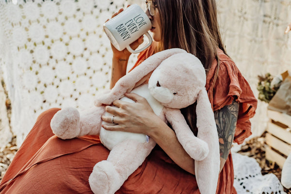 Woman holding a Pink Nibble Bunny