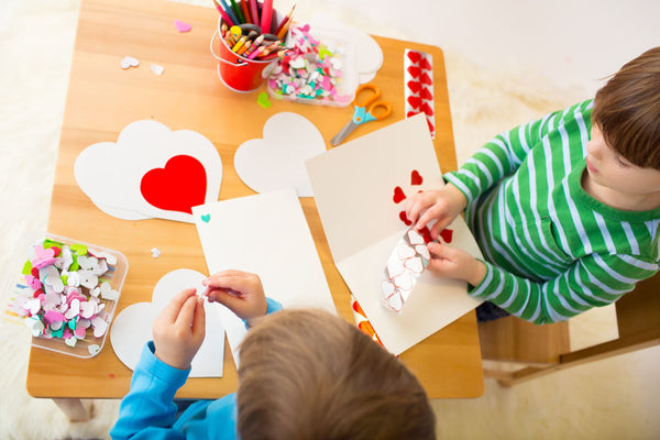 Kids making Valentine crafts