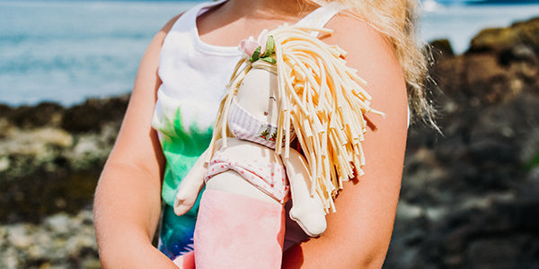 Doll with a face mask on it