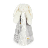 White plush bunny with a gray blanket featuring text on a white background