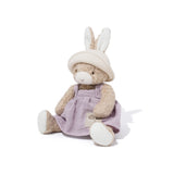 Plush toy rabbit in a purple outfit on a white background