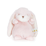 Pink plush bunny toy with a white tag on a white background