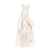 front view of White plush bunny toy with a blanket on a white background