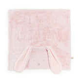 A soft pink plush blanket with a bunny face and long floppy ears, photographed on a clean white background.