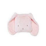 A light pink plush bunny pillow with floppy ears and embroidered facial features, photographed on a clean white background.