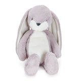 Plush toy rabbit with white belly on a white background