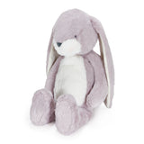 Plush bunny toy with purple fur on a white background