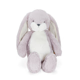 Plush toy rabbit with light purple fur on a white background