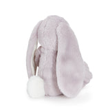Plush bunny toy with fluffy tail on a white background