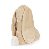 Beige plush bunny hat on a white background