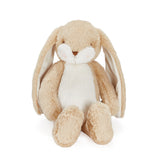 Plush bunny toy with beige and white fur on a white background