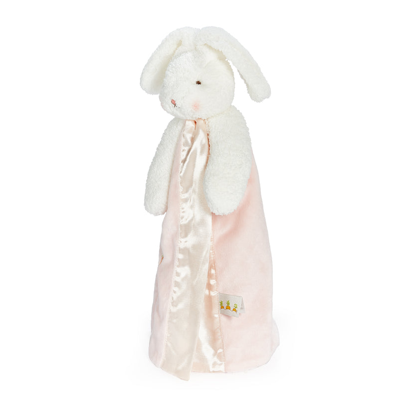 White plush bunny with a pink blanket on a white background
