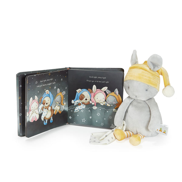 Children's book with illustrations of animals in hats and a plush bunny toy with a yellow hat on a white background