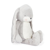 Gray plush toy with long ears on a white background