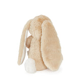 Beige plush bunny toy on a white background