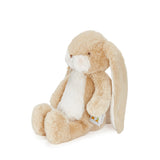 Beige plush bunny toy with a white belly on a white background