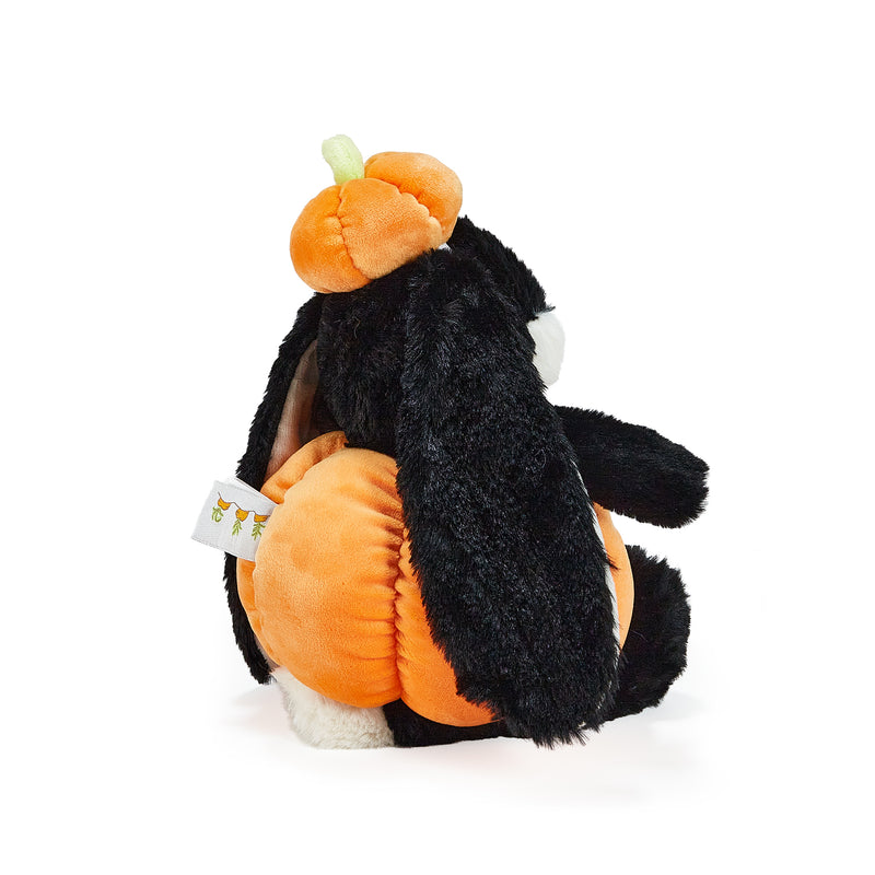 Plush toy bunny wearing an orange pumpkin costume on a white background