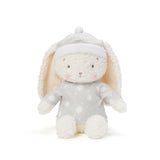 Stuffed bunny toy with a white hat on a white background