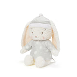 Plush toy rabbit in a gray outfit with a white hat on a white background