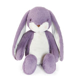 Purple stuffed animal bunny with long ears on white background