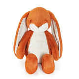 Orange stuffed animal bunny with long ears on white background