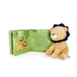 Plush lion toy with a book featuring lion illustrations on a white background