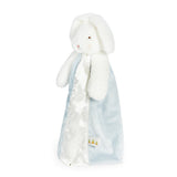 side view White plush bunny with a blue and white blanket on a white background