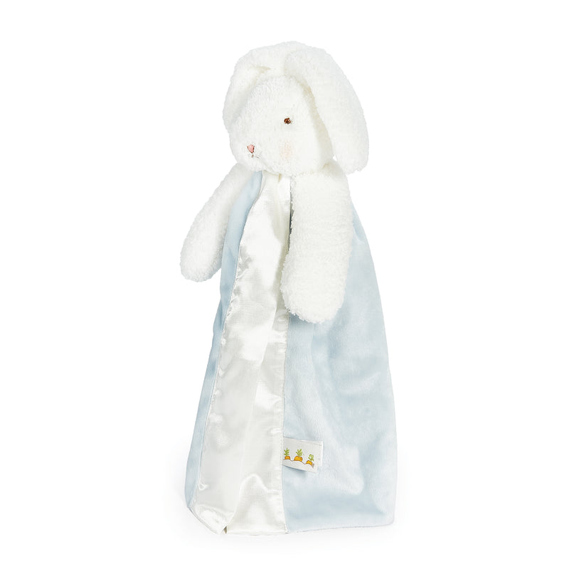 side view White plush bunny with a blue and white blanket on a white background